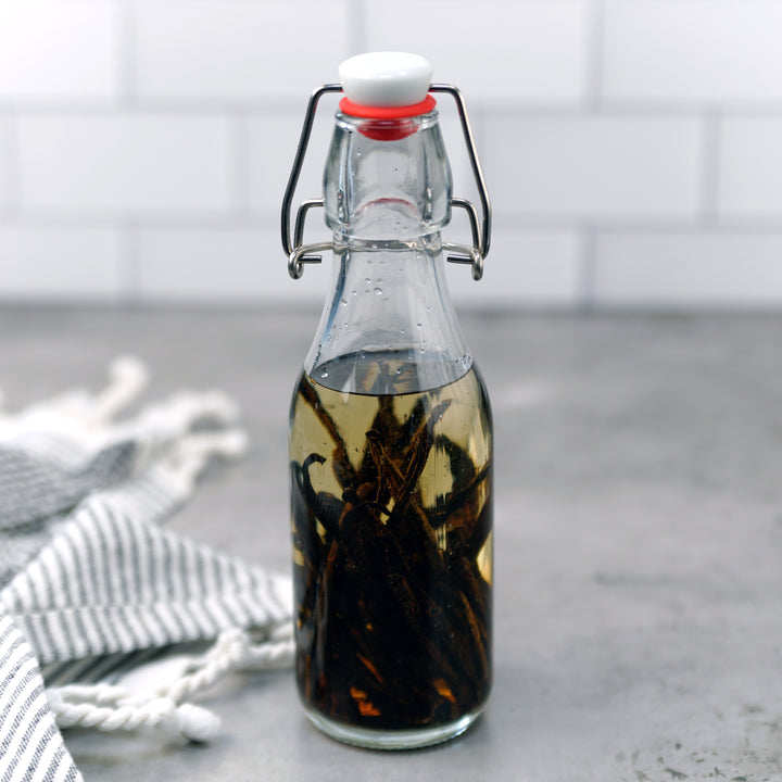 vanilla beans extracting in glass jar