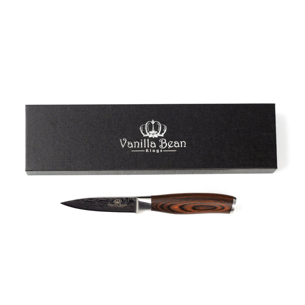 Paring knife with vanilla bean kings etched on the blade with black box and vanilla bean kings logo